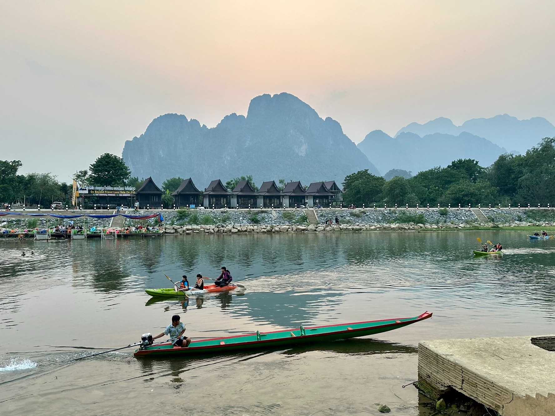 View of a river with boats and karst mountain the background