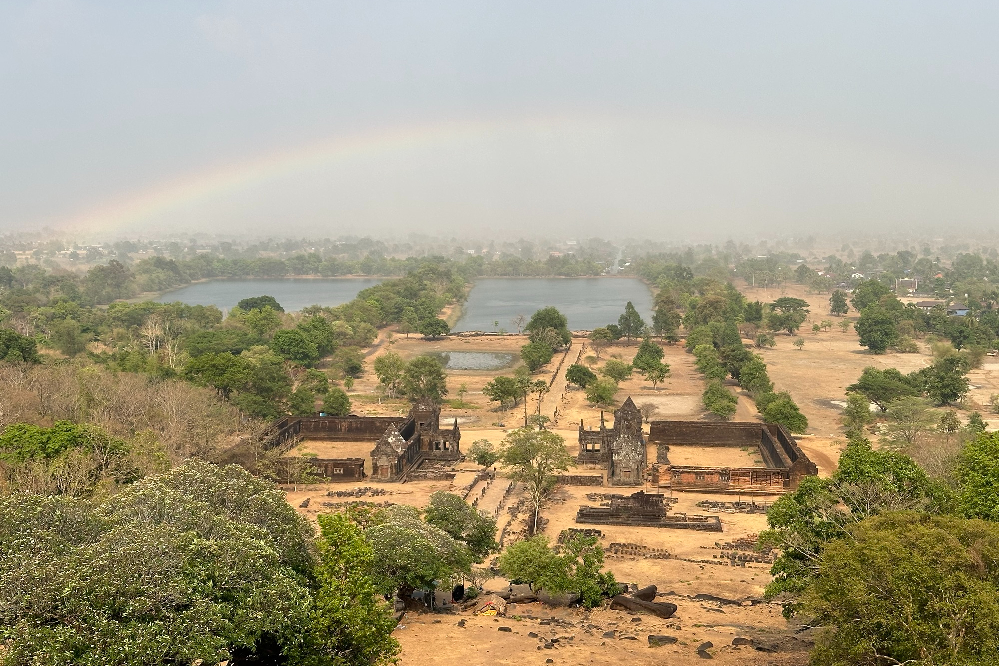 View of a full rainbow above Vat Phou temple