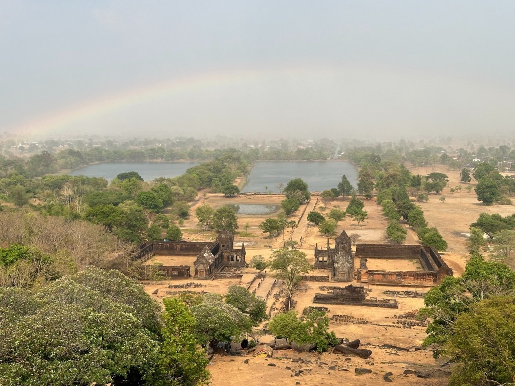 View of a full rainbow above Vat Phou temple