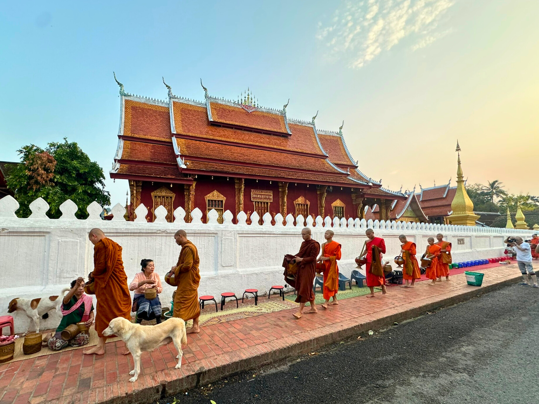 View of the monks with orange robe and temple